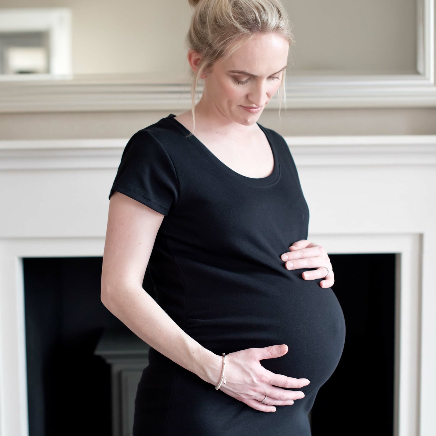 Black organic maternity top with long length and ruching