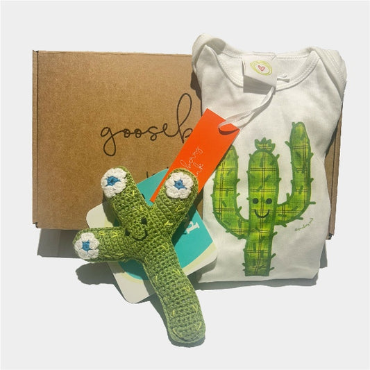 Cactus-themed New Baby Gift Box with organic cotton bodysuit and soft toy rattle