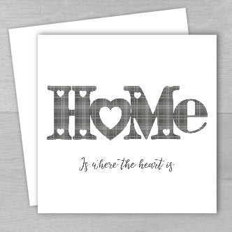 A new home card with a tartan design and the text 'Home is where the heart is' on the front, accompanied by a matching envelope.