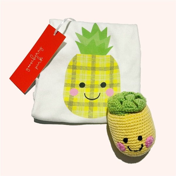 Pineapple-themed New Baby Gift Box with organic cotton bodysuit and soft toy rattle