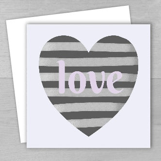 A greeting card with a striped heart design and the word 'love' in the center, presented with a white envelope.