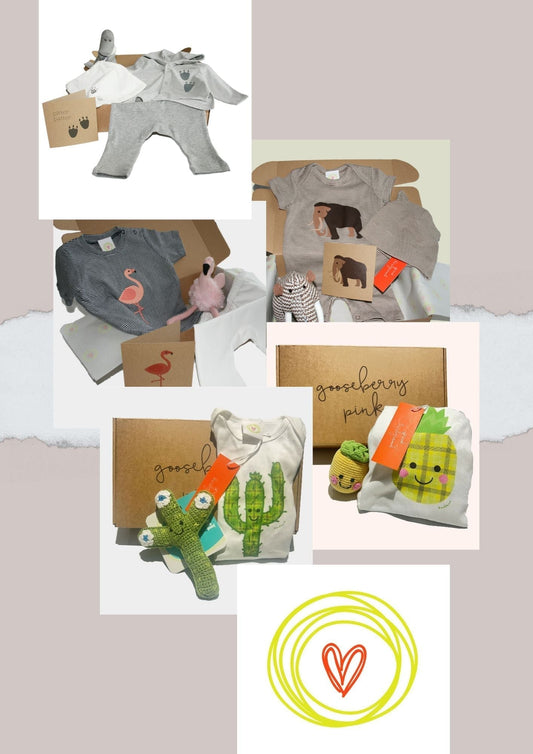 A collection of organic cotton baby gift boxes from Gooseberry Pink, featuring eco-friendly, ethically made baby shower gifts with toys and clothing in various themes like flamingo, cactus, dinosaur, pineapple, and mammoth.