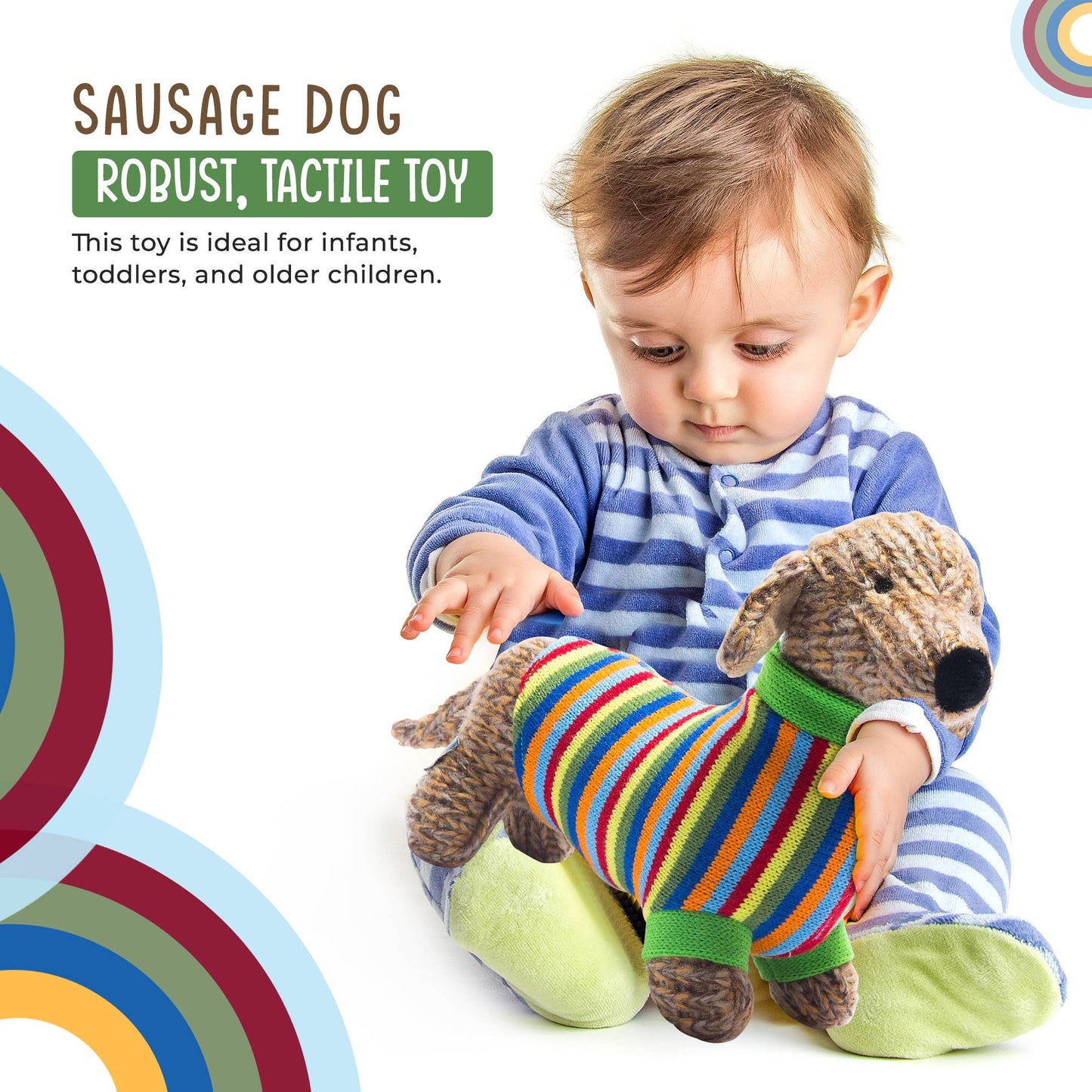 Child playing with a plush toy dog wearing a colorful sweater on a white background
