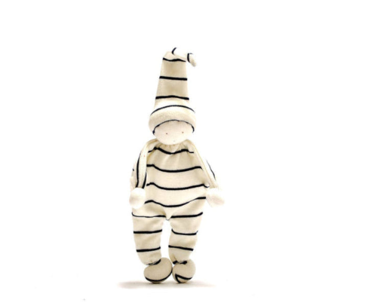 Stuffed toy in a zebra-striped outfit on a white background