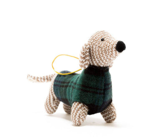 Knitted dog toy wearing a plaid sweater on a white background