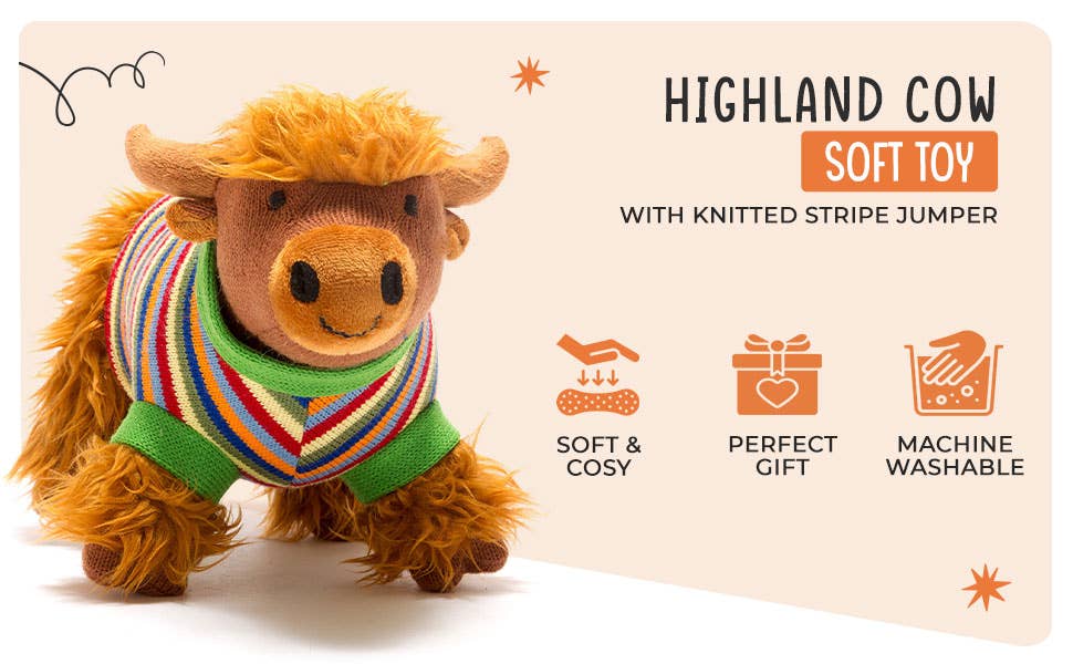 Plush toy Highland cow wearing a knitted striped sweater on a beige background
