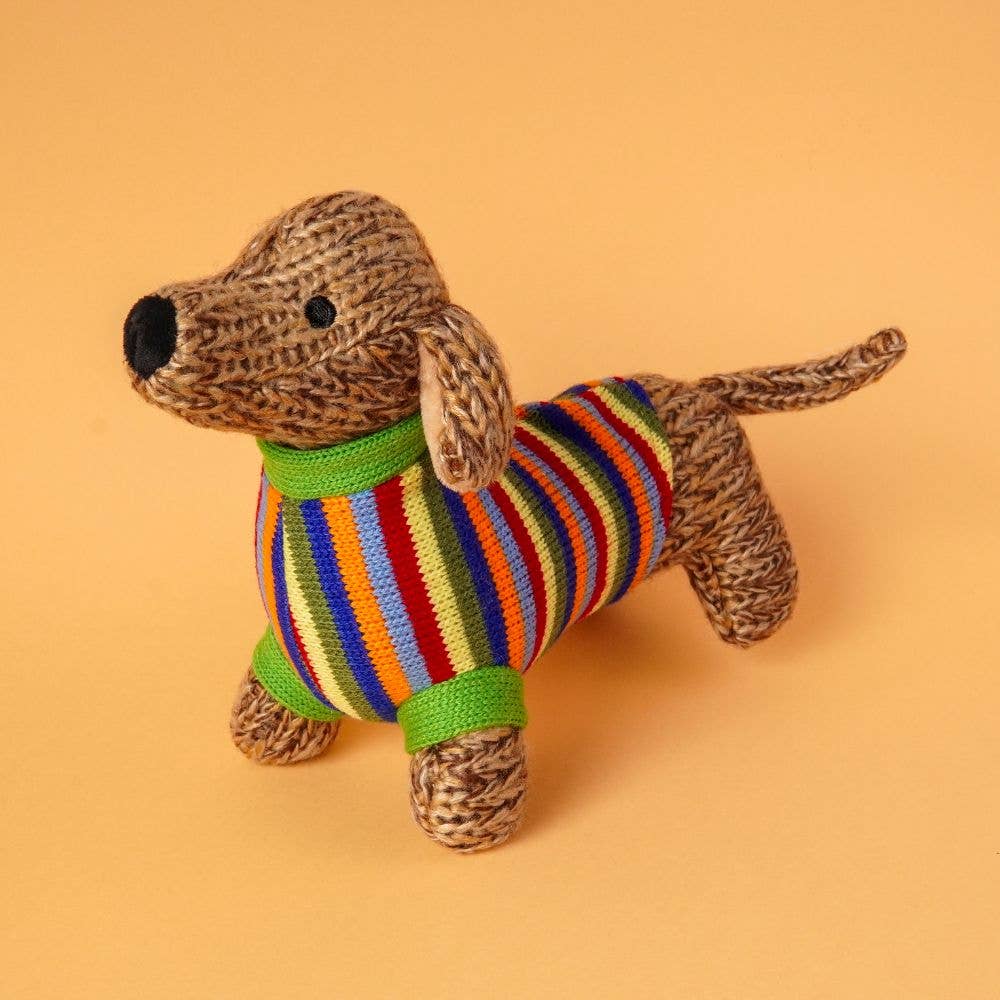 Dog toy with a striped sweater on an orange background
