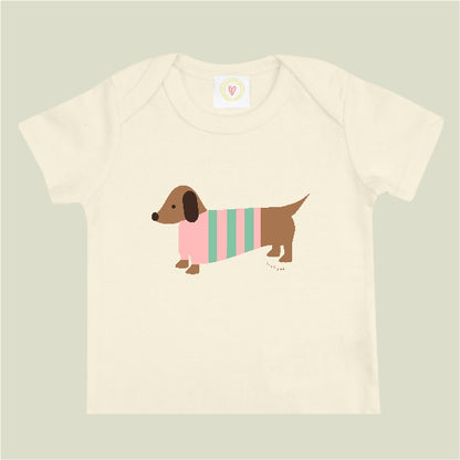 Organic cotton cream baby t-shirt with hand-printed pink sausage dog design