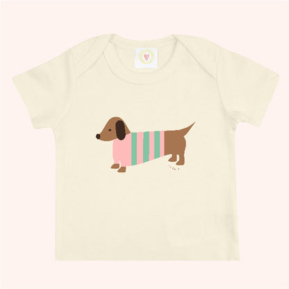 Organic cotton cream baby t-shirt with hand-printed pink sausage dog design