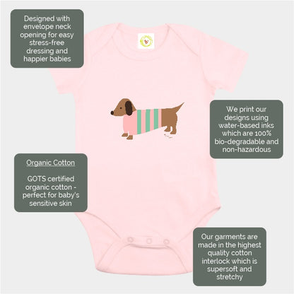 Organic cotton pink baby bodysuit with hand-printed sausage dog design