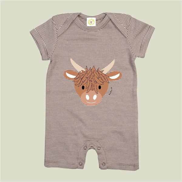 Striped baby romper with a highland cow design on a beige background