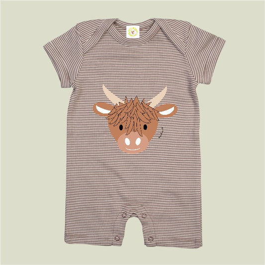 Striped baby romper with a highland cow design on a beige background
