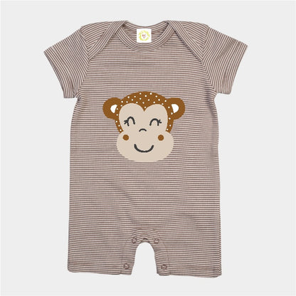 Striped baby romper with monkey face design on a white background