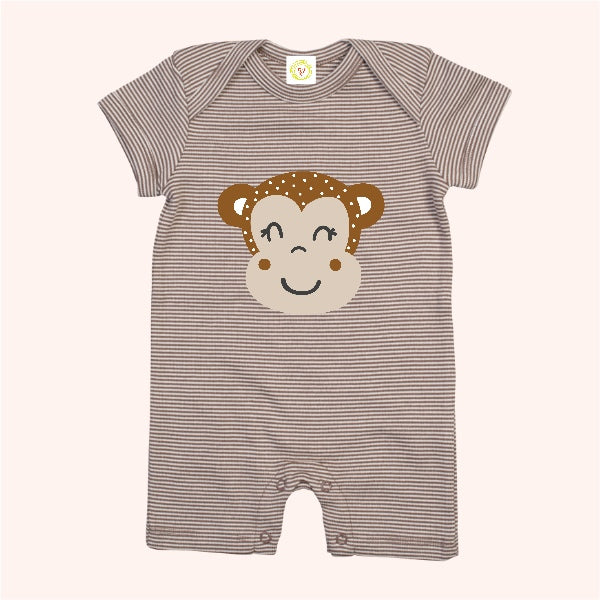 Striped baby romper with monkey face design on a white background