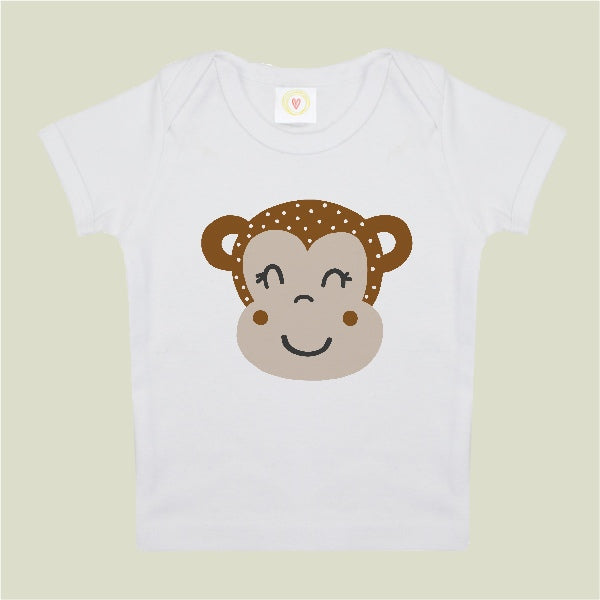 White t-shirt with a monkey face design on a light green background
