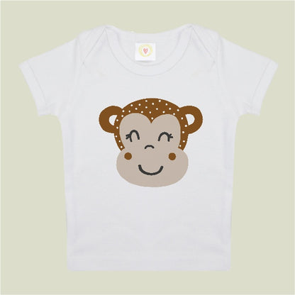 White t-shirt with a monkey face design on a light green background