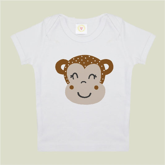White t-shirt with a monkey face design on a light green background