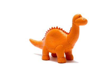 An orange textured toy dinosaur with a long neck and spiky back, standing on a plain white background.