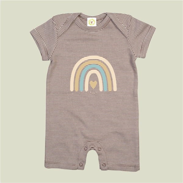 Striped baby romper with rainbow design on a beige background