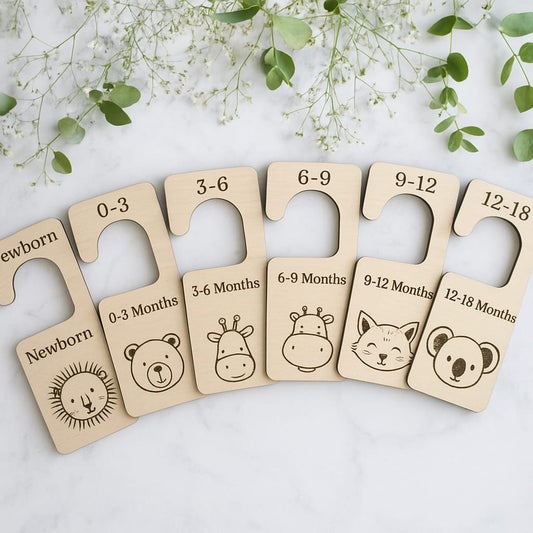 Wooden age milestones for babies with animal illustrations on a light background