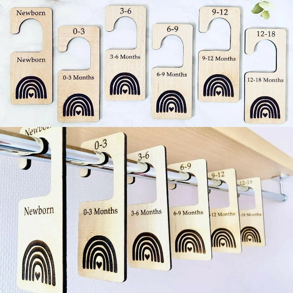 Wooden baby growth chart with rainbow design on a white background