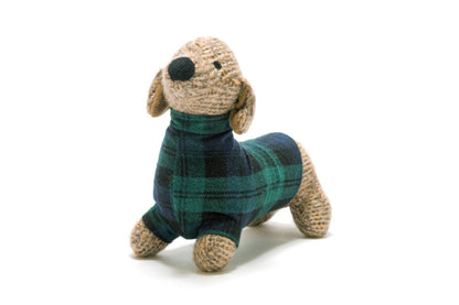 Knitted dog toy with a plaid pattern on a white background