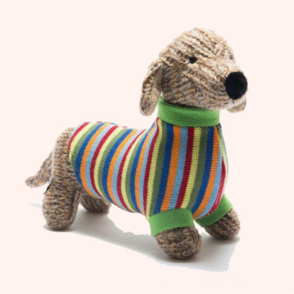 Knitted dog toy with a colorful striped sweater on a white background
