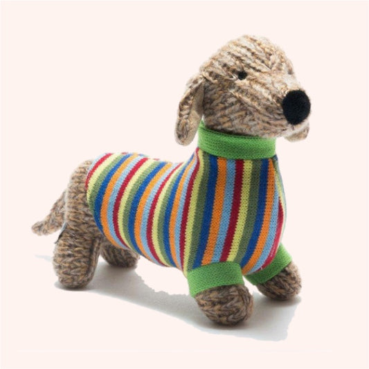 Knitted dog toy with a colorful striped sweater on a white background