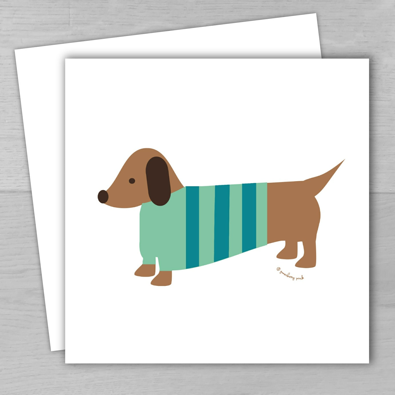 Illustration of a dachshund wearing a striped sweater on a white card with a gray background